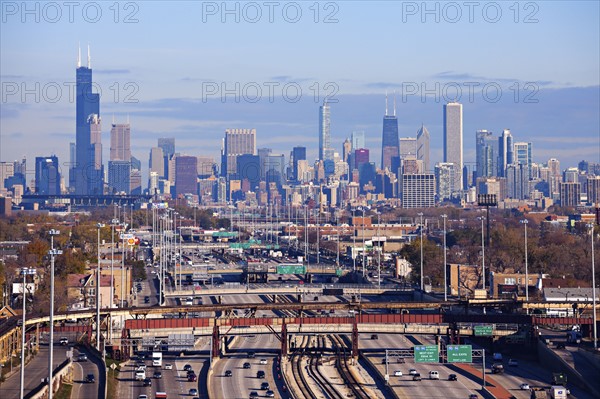 Illinois, Chicago, Urban scene with car traffic and skyscrapers in distance