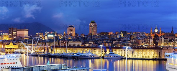 Italy, Liguria, Genoa, Panorama of harbor at dusk