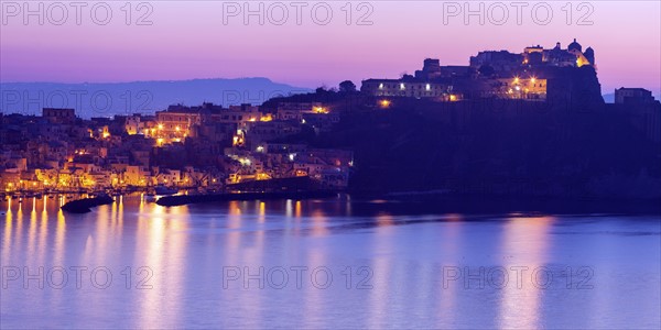 Italy, Campania, Naples, Panorama of Procida Island at sunrise