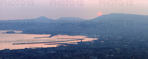 Italy, Campania, Naples, Panorama of city at sunrise