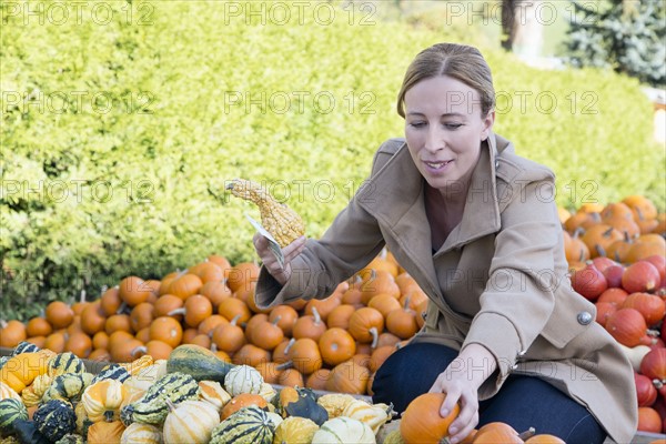 Austria, Salzburger land, Maria Alm, Mature woman amongst vegetables