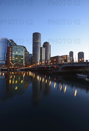 Massachusetts, Boston, Skyscrapers reflecting in Fort Point Channel at dusk