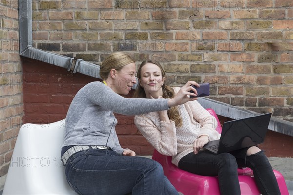 Women looking at smart phone