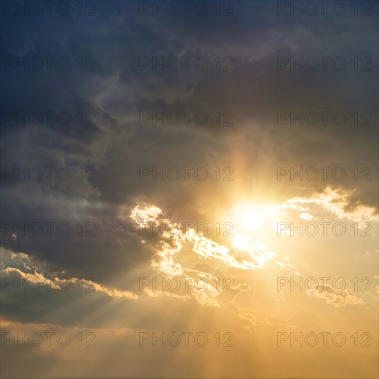 Sun breaking through clouds.