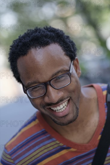 Portrait of mid adult man laughing.