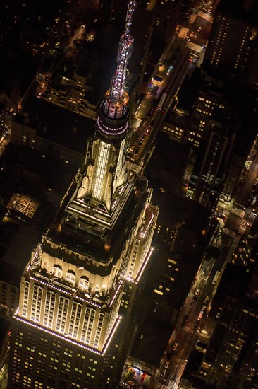 USA, New York, New York City, Aerial view of illuminated Empire State Building at night.
