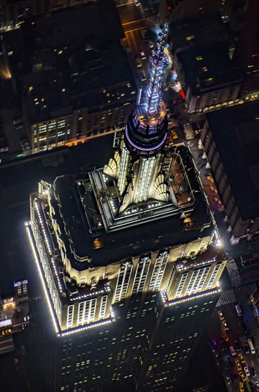 USA, New York, New York City, Aerial view of illuminated Empire State Building at night.