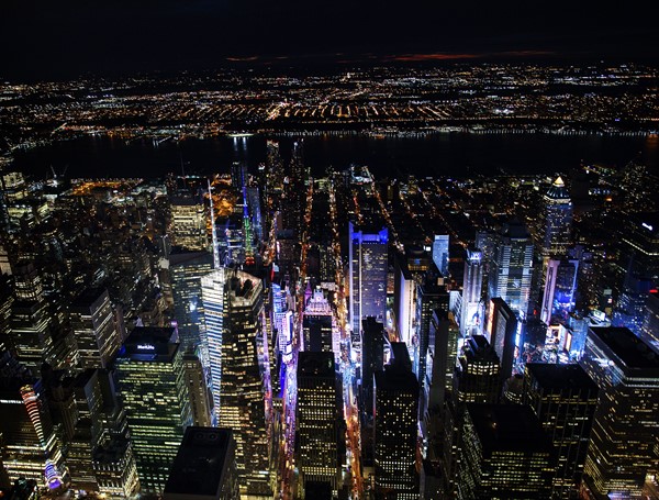 USA, New York, New York City, Manhattan, Aerial view of illuminated skyline with Times Square at night.