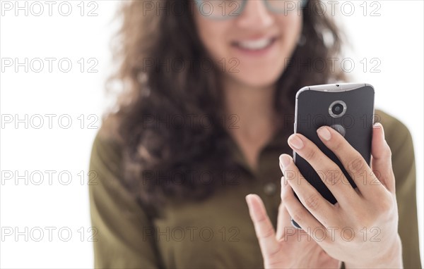 Young woman using smart phone.