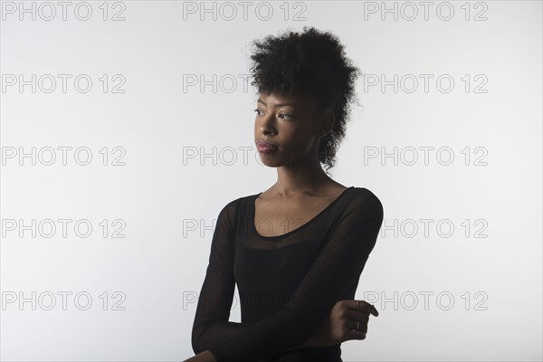 Young woman with arms crossed.