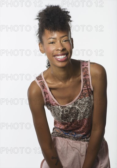 Portrait of fashion model in sleeveless tunic.