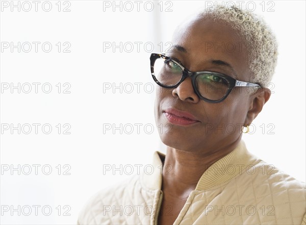 Portrait of serious woman looking at camera.