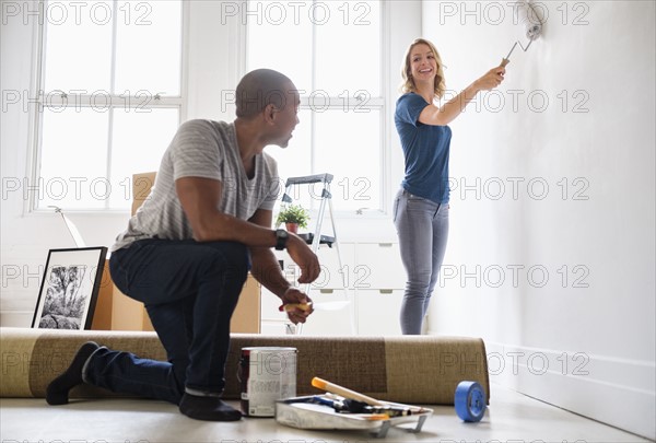 Couple renovating apartment.