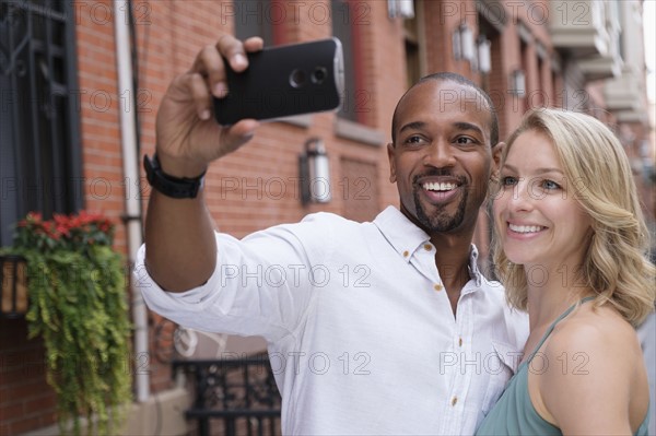 Couple taking selfie.