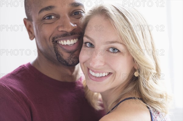 Portrait of happy multi ethnic couple.