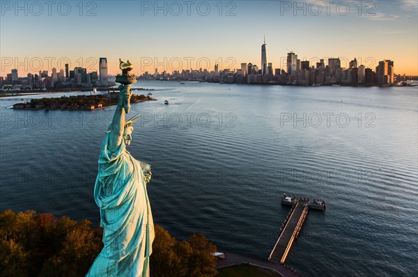 USA, New York State, New York City, Aerial view of Statue of Liberty at sunrise.