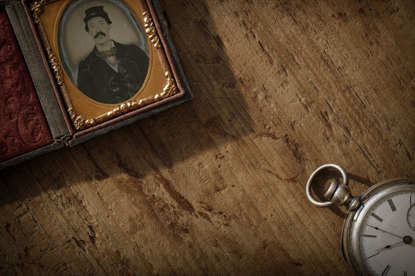 Antique photograph and pocket watch.