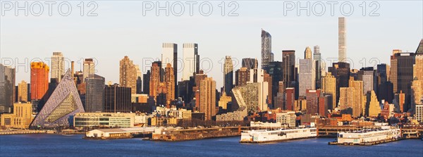 USA, New York State, New York City, Waterfront skyline at sunrise