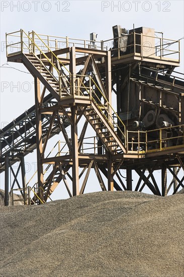 Conveyor belt over sand heap