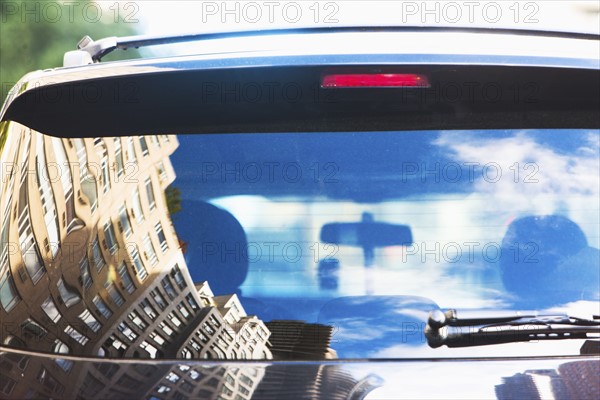 USA, New York State, New York City, City street reflecting in car rear window