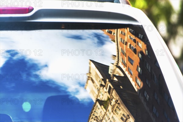 USA, New York State, New York City, Townhouses reflecting in car rear window