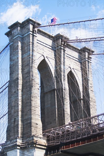 USA, New York State, New York City, Brooklyn bridge detail with American flag on top