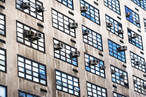 USA, New York State, New York City, Air conditioners on facade of skyscraper