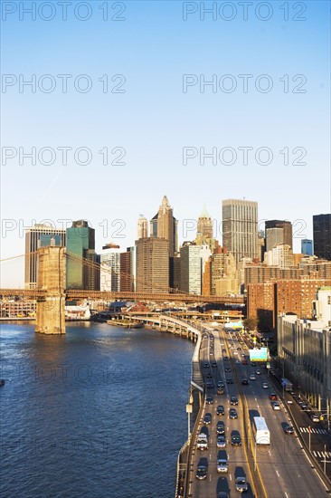 USA, New York State, New York City, Manhattan, Franklin D. Roosevelt East River Drive and Brooklyn Bridge at sunset