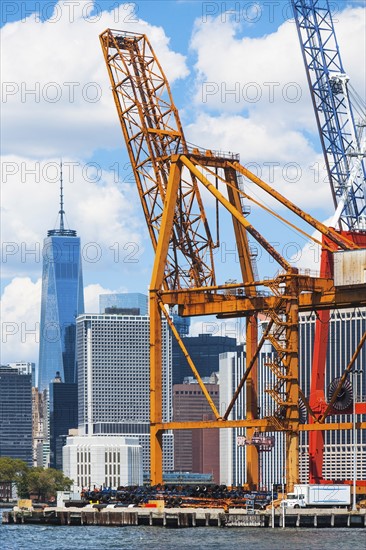 USA, New York State, New York City, Manhattan, Commercial dock against city skyline