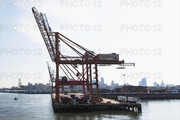 USA, New York State, New York City, Commercial dock and city skyline in background