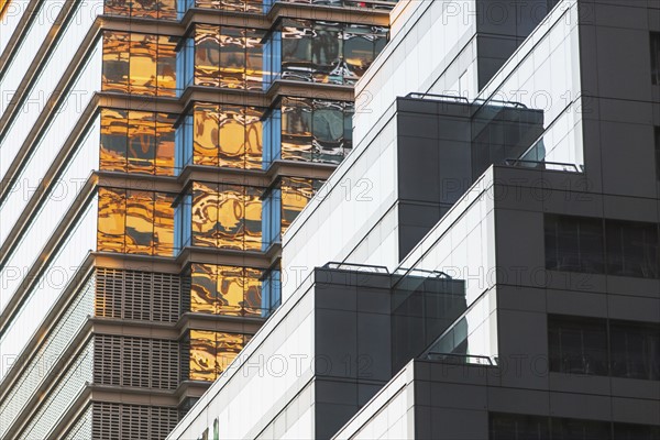 USA, New York, New York City, Glass facade of office building