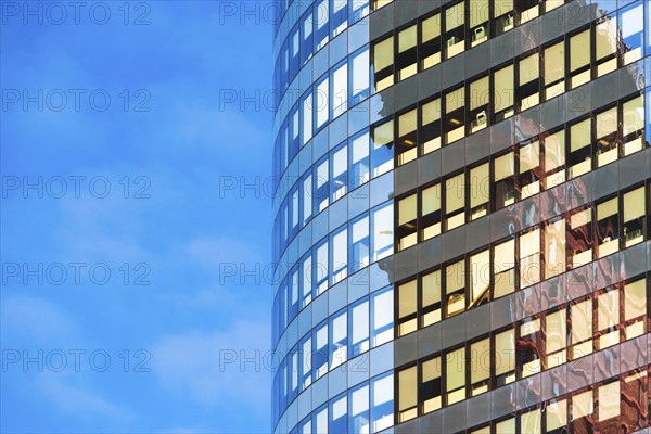 New York, New York City, Curved office building with blue sky in background