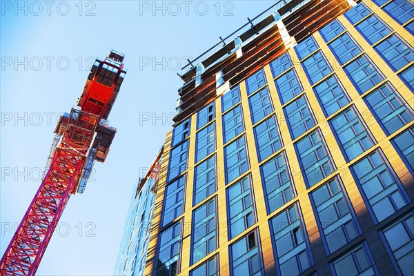 USA, New York, New York City, Office building next to crane