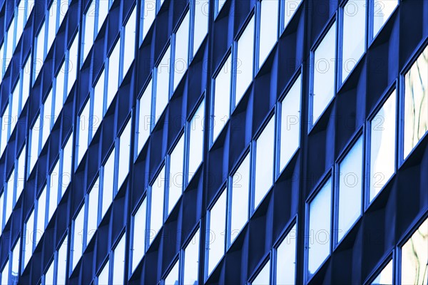 USA, New York, New York City, Glass facade of office building