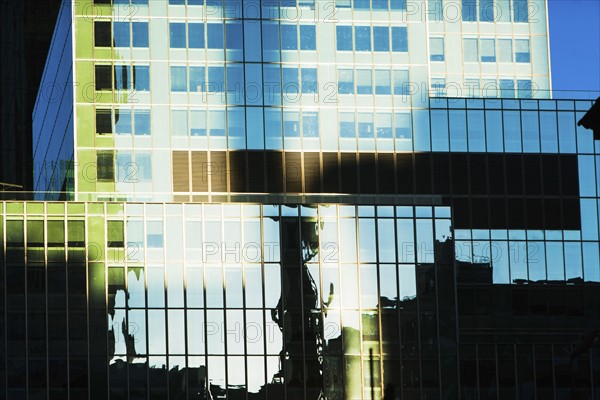 USA, New York, New York City, Glass facade of office building