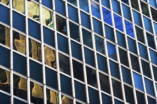 USA, New York, New York City, Glass facade of office building