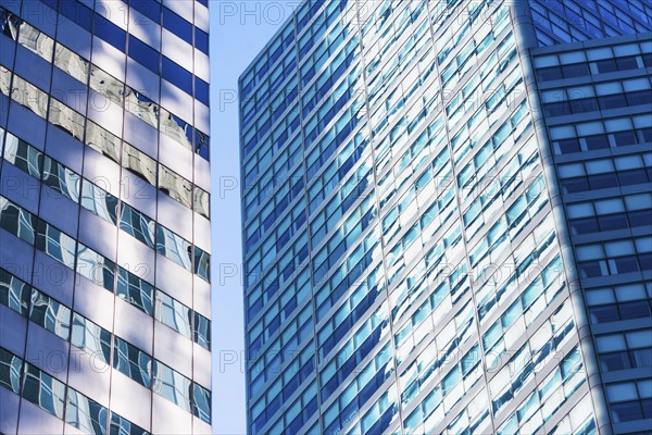 USA, New York, New York City, Glass facade of office buildings