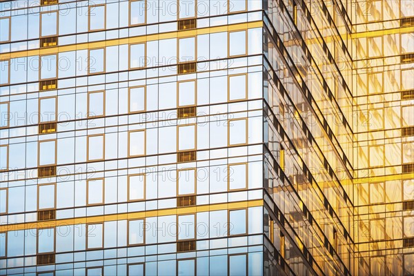 USA, New York, New York City, Glass facade of office building