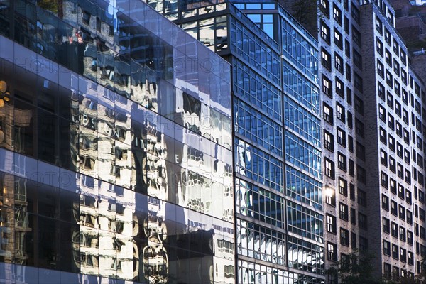 USA, New York, New York City, Glass facade of office building