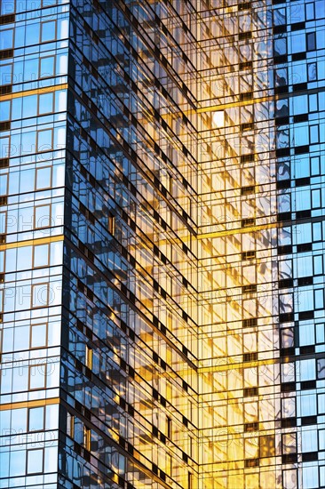 USA, New York, New York City, Glass facade of office building