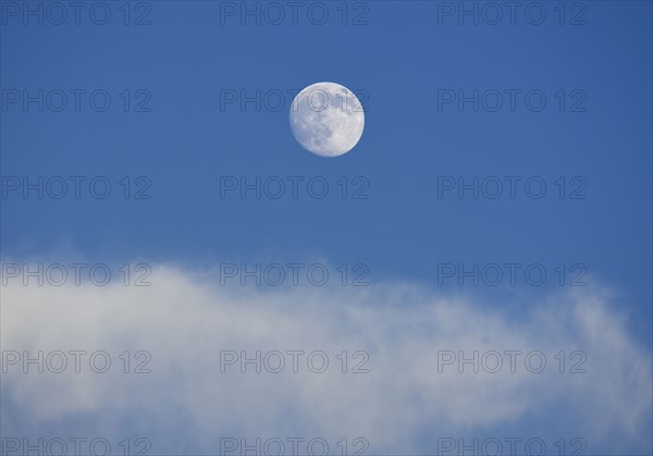 Full moon on blue sky