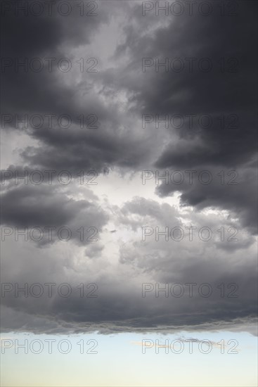 Storm clouds gathering on late evening sky