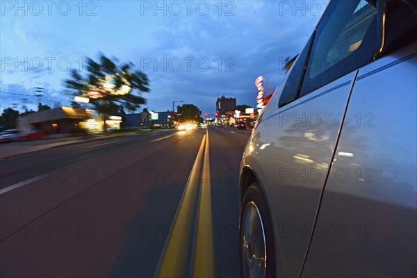 USA, Colorado, Denver, Car on city street at dusk