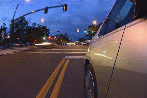 USA, Colorado, Denver, Car on city street at dusk