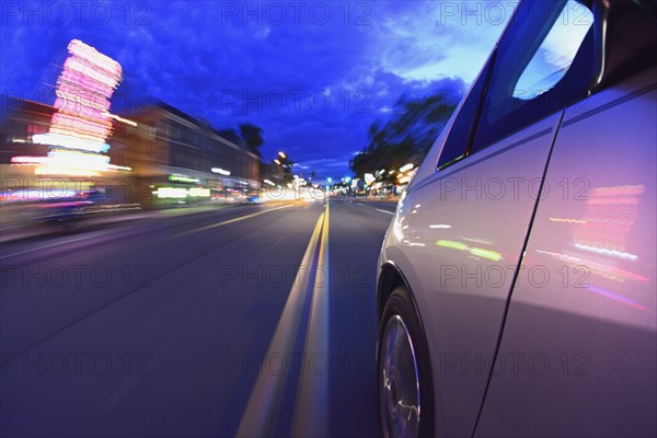 USA, Colorado, Denver, Car on city street at dusk