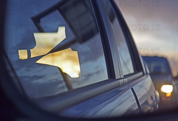 Reflections of city traffic in car's window