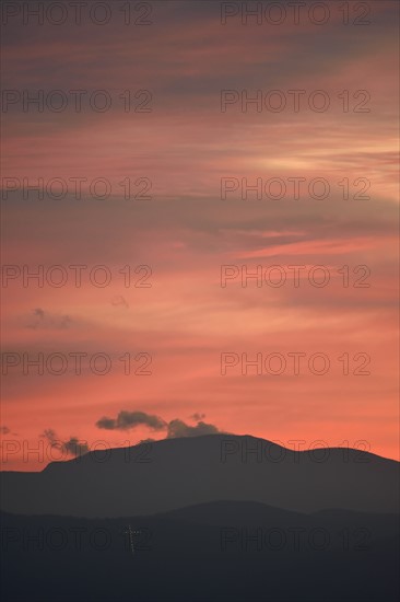 USA, Colorado, Denver, Colorful sky over mountain range