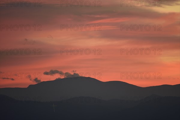 USA, Colorado, Denver, Colorful sky over mountain range