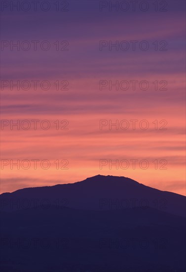 USA, Colorado, Denver, Mountain range with colorful sky at dusk