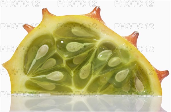 Part of dragonfruit against white background